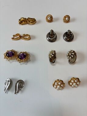 Brand-name assorted women’s clip and screw back earrings.